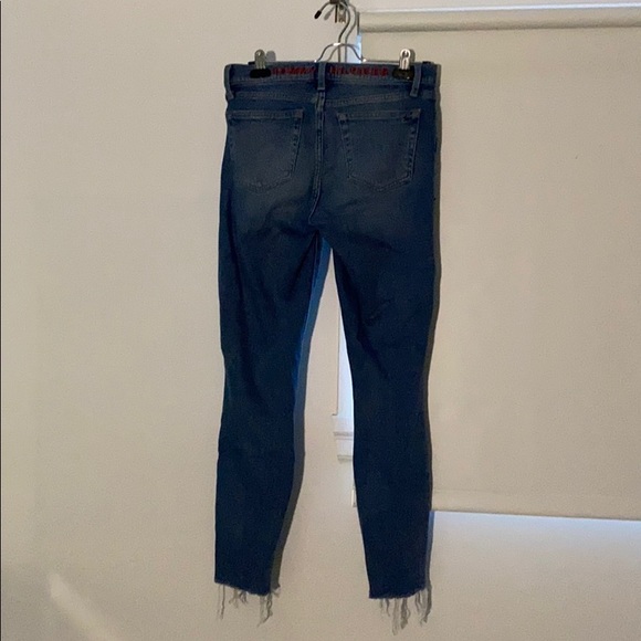 Washed up jeans, ripped at the bottom. - Picture 2 of 5